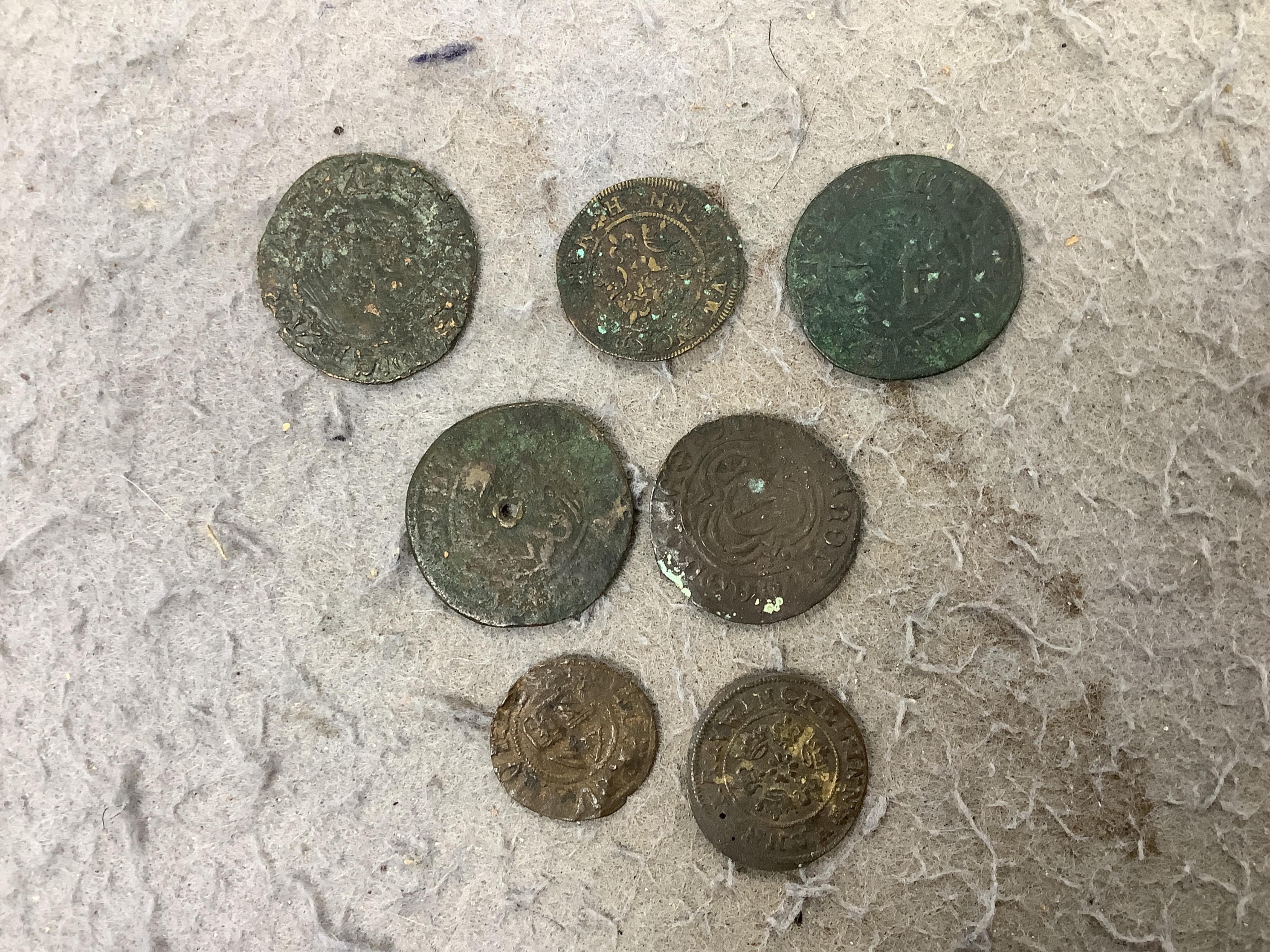 A large collection of halfpenny tokens and gaming tokens, 17th to early 20th century, in an album